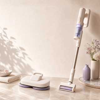 Cordless floor-care and cleaning appliances in a premium neutral interior setting